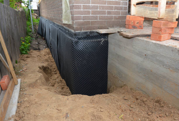 Happy homeowners after waterproofing job in Vandiver
